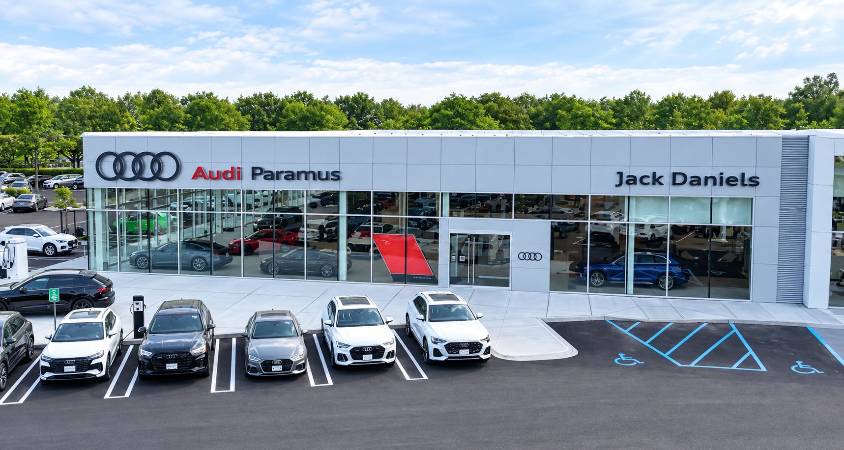 Audi Sale Specialist walking through the showroom with a couple.